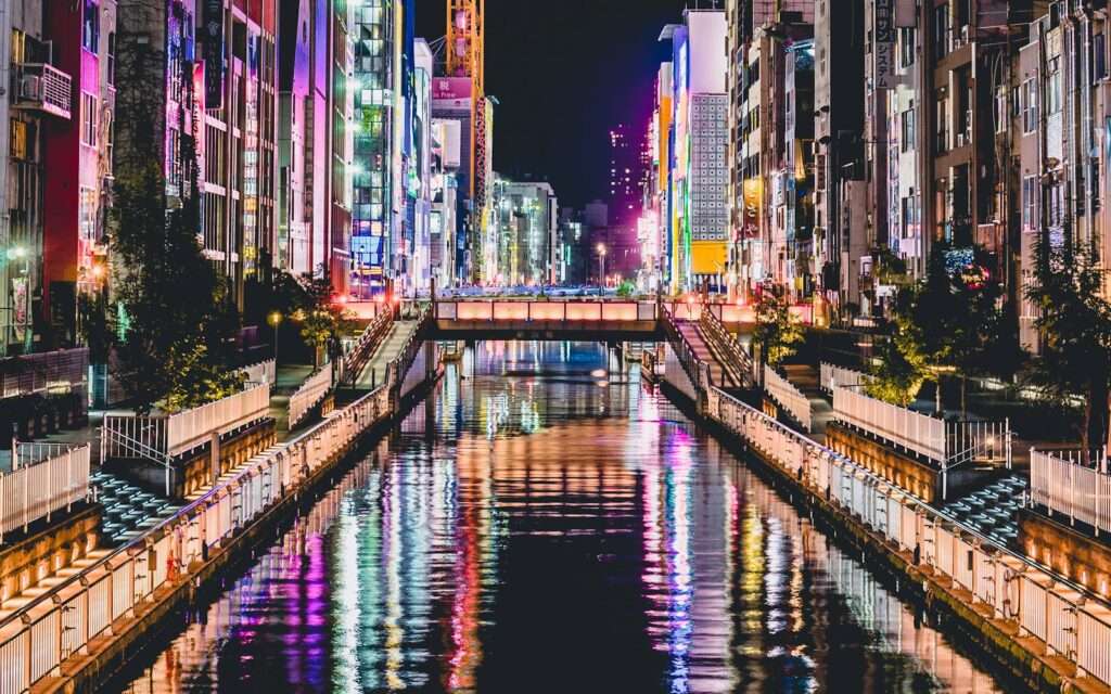 Neon signs reflected in the Dotonbori canal at night